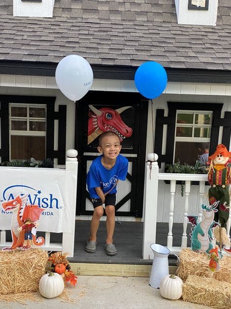 Chase smiling in his new dragon-themed playhouse
